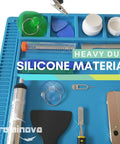 Close-up of Pro Grade Large Soldering Mat 55x35cm Magnetic Silicone Work Surface with tools and components for repairs.