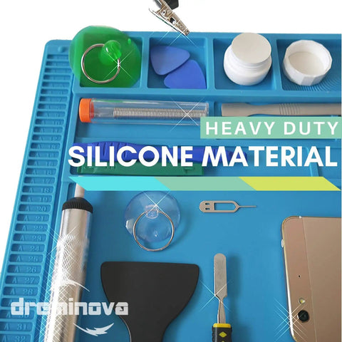 Close-up of Pro Grade Large Soldering Mat 55x35cm Magnetic Silicone Work Surface with tools and components for repairs.