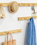 Natural Wood Wall Coat Rack Set Of 4 Wall Mount Hooks For Towels Hats Keys And Shoes And Vertical Coat Hanger shown with items hanging
