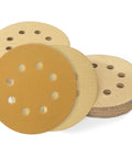 Top Tier 5 Inch Hook And Loop Sanding Discs With 40 To 1000 Grit Assorted Aluminum Oxide Pads stacked for random orbital sanders.