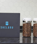 Keep Your Beans Fresh As A Daisy With This Smart Electric Vacuum Seal Coffee Canister And Airtight Storage Jar For Whole Ground Roasts Real Deal Smooth Push Button Operation Durable Borosilicate Glass with two jars and a black box.
