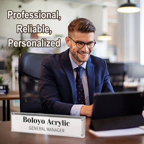 Office setup with Acrylic Desk Name Plate Holder For Office 2x8 Inch Double Sided shows 'General Manager' with man working on laptop