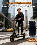 Rider using Beefy 3500W 11-Inch Hub Motor for electric scooters in urban setting, showcasing brushless power and tubeless off-road capability.