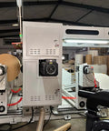 Industrial Smooth Operation Heavy Duty Automatic Jumbo Roll Slitter Machine Featuring Differential Slip Shaft For Insulation Paper Sheets setup with large parent rolls.
