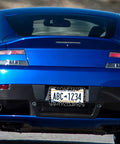 Leopard Print License Plate Frame Two Pack Aluminum Car Tag Frames With Screws Caps Front End Decor For Vehicles Durable Corrosion Resistant Auto Accessory on a blue sports car rear.