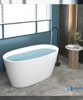 Oil Rubbed Bronze Freestanding Tub Filler With Single Lever Handle Floor Mounted Brass Bath Faucet next to a white tub