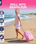 Child with Unicorn Themed Rolling Sand Toy Suitcase For Kids Beach Fun With Water Play Table And Wheels on the beach.