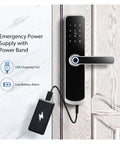 Rock Solid Hella Weatherproof Tuya WiFi Smart Door Lock With Fast Fingerprint Scan And Top Shelf Knock Sensor Doorbell For Next Level Home Security Silver with emergency power supply attached.