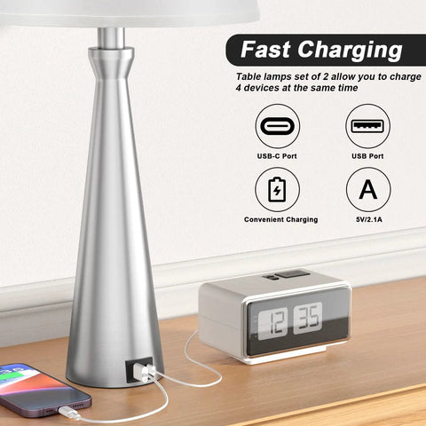 Set Of 2 Modern Table Lamps For Living Room And Bedroom With USB C And USB A Charging Ports Dimmable Touch Bedside Lamps With White Fabric Shade Nickel Finish Ideal For Master Or Guest Rooms End Table Lighting featuring a nickel finish lamp with charging ports and devices connected.