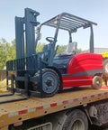 Rock Solid Industrial Hydraulic Forklift Truck With Three Ton Capacity And 15 Foot Mast Height displayed on a truck for transport.