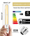 Hand holding dimmable LED T10 bulb with E26 base, clear glass; 6 Pack E26 LED Bulbs 6W Dimmable 2700K Soft White 800 Lumens Equal 80W Tubular T10 T9 Long Clear Glass For Rustic Pendant Lights Pipe Wall Sconces And Chandeliers.