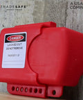 Adjustable Flanged Ball Valve Lockout For Two Inch To Four And One Half Inch Flanges Red Polypropylene Valve Lock For Gas Oil Or Water Lines Lockout Tagout Industrial Grade Built Tough, mounted on wall.