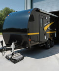 Heavy Duty Electric Trailer Mover Tackles 9000 Lbs Loads With Zero Sweat Via Remote Control Wireless Link, positioned under a camper.