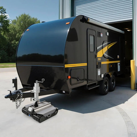 Heavy Duty Electric Trailer Mover Tackles 9000 Lbs Loads With Zero Sweat Via Remote Control Wireless Link, positioned under a camper.