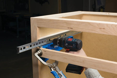 Person installing drawer slide using Drawer Slide Jig And Concealed Hinge Jig Kit For Cabinets And Desks, No Fuss Install Of Cabinet Slides