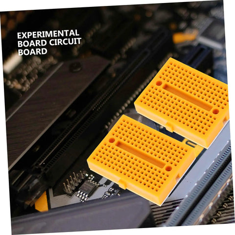 Plug And Play Solderless Breadboard Kit With Six Compact Yellow Protoboard Panels For Rapid Circuit Assembly and Hassle Free Electronics Crafting For Tech Students And Weekend Builders, shown on a circuit board.