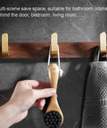 Straight Up Sturdy Five Hook Wall Coat Rack designed for hanging daily duds, featuring durable wood with hooks for bathroom use.