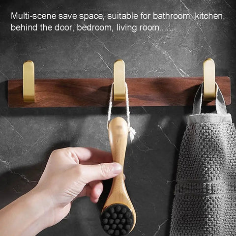 Straight Up Sturdy Five Hook Wall Coat Rack designed for hanging daily duds, featuring durable wood with hooks for bathroom use.