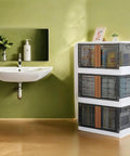 No Sweat Organizing With These Heavy Duty Plastic Storage Boxes With Lids, Built Tough 19 Gallon Collapsible Folding Bins For Closets And Garages Stackable Home Organization Crates 3 Pack in a bathroom setting.