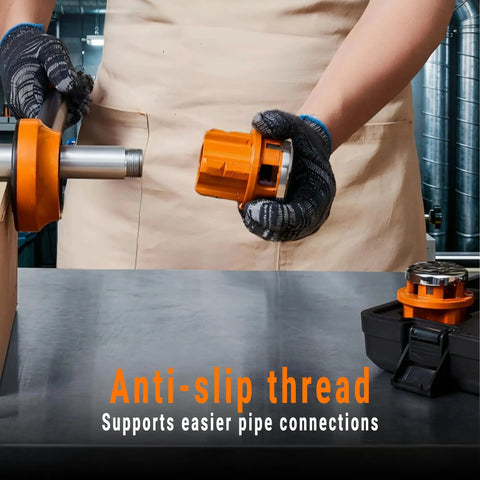 Person using Heavy Duty Ratchet Pipe Threader Kit With Six NPT Dies One Quarter Inch Three Eighths Inch One Half Inch Three Quarters Inch One Inch And One And A Quarter Inch Threading Dies Durable 9SiCr Steel Tool For Galvanized Iron Copper And Aluminum Pipes on a table, focusing on anti-slip thread feature.