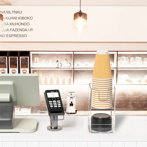 Two Tier Upright Cup And Condiment Organizer With Two Compartment Clear Acrylic Cup Dispenser on a coffee counter