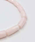 Premium Pink Calcite Faceted Tube Beads 20x10mm Genuine Natural Stone For Jewelry Making, close-up of faceted pink beads.