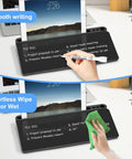 Glass Desktop Whiteboard With Storage And Keyboard Tray Go To Desk Accessory For Home Office And School Setup Black shown being used and wiped clean.