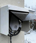 Universal EV Charger Cover With Wall Mount Hardshell Enclosure And Sloping Waterproof Canopy protecting charger in snow.