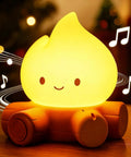 Lit Campfire Night Light Portable Flameless Candle with White Noise cute silicone flame lamp on a wood-like base with music notes