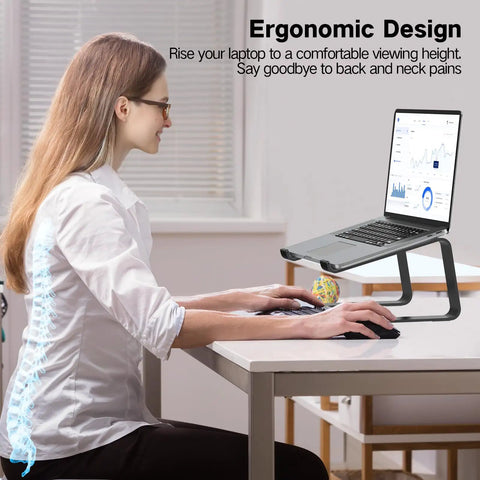 Woman using laptop on Aluminum Laptop Stand For Desk With Ventilated Cooling, Ergonomic 5.98 Inch Riser Elevates Your Screen.