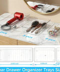 14 Pcs Clear Plastic Drawer Organizer Set With Two Extra Large 15X6 Trays, showing modular trays storing hairdryer, brushes, and clips