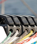 Installed Spinlock XTS rope clutch, single alloy unit for 8–14 mm rope, on boat deck with braided lines