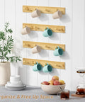 Natural Wood Wall Coat Rack Set Of 4 Wall Mount Hooks holding mugs in a kitchen setting
