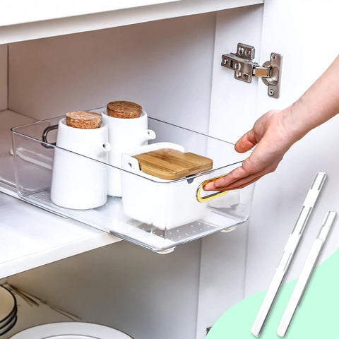 No Sweat Self Adhesive Drawer Slides Four Pack in use with transparent drawer holding white containers in cabinet.