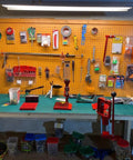 Workbench with tools and ESD Soldering Mat Roll 23.6 by 118 Inches Rubber Workbench Pad 0.08 Inch Thick Anti Static Heat Resistant.