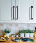 10 Pack 5 Inch Matte Black Cabinet Handles For Kitchen Cabinets And Drawers, 128mm Length, installed on white kitchen cupboards