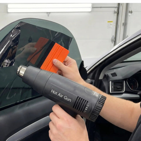 All-In-One Vinyl Wrap Heat Gun Kit For Cars And Window Tinting, 1800W 110V Hot Air Tool With Squeegees in use on car window