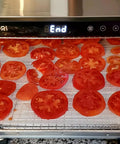 Tomato slices on 8 Pcs Silicone Dehydrator Sheets Set in use, Premium Non Stick Dehydrator Mats For Food Dehydration, 14x14 Inches