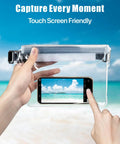 Person using Waterproof Fanny Pack Pouch For Beach And Cruise Trips With Roll Top Closure And Zippers with phone inside on beach.