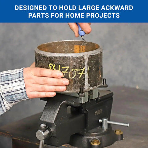 Rock Solid Five Inch Workbench Vise With Knockout Grip Smooth Non Marring Jaws And Heavy Duty Locking Mechanism holding large awkward part.