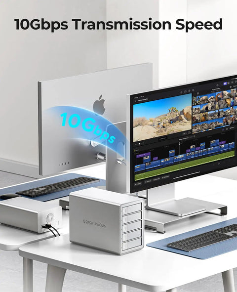 Massive 5 Bay Hard Drive Enclosure delivers hassle free installation with true daisy chain linking for up to 330Tb total storage paired with blazing 10Gbps USB 3 2 Gen 2 transfer speeds on a desk with a monitor.