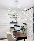 Sputnik Chandelier Light Fixture With Chrome Finish in modern office with multiple aluminum arms and ambient lighting