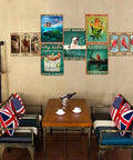 Living room wall with various vintage metal signs featuring animals and motivational quotes, Union Jack pillows on chairs.