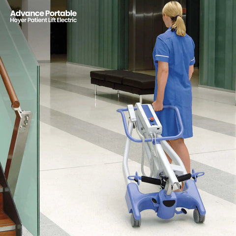 Nurse moving electric portable patient lift with folding design in hallway