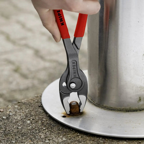 10 Inch Pliers With Front And Side Grips For Stripped Screws And Bolts gripping a rusty bolt on metal surface