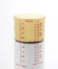 Two Cup Adjustable Measuring Cup With Grippy Rotating Body For Easy Pouring Of Peanut Butter And Honey filled with butter