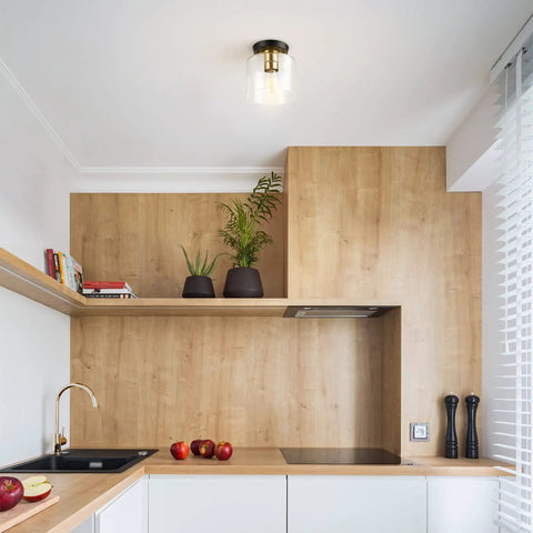 Polly 1 Light Flush Mount Ceiling Light With Black Finish, Clear Glass Shade, installed in modern kitchen
