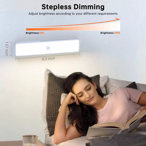 Stick Anywhere Closet Light Kit With Motion Sensor 6 Pack 30 LED Dimmer under cabinet light above woman reading in bed