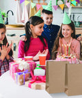 Children at birthday party with Brown Paper Bags With Handles 8x4.25x10.5 Inches Medium Gift Bags Bulk 100 Pack Recycled Kraft Paper