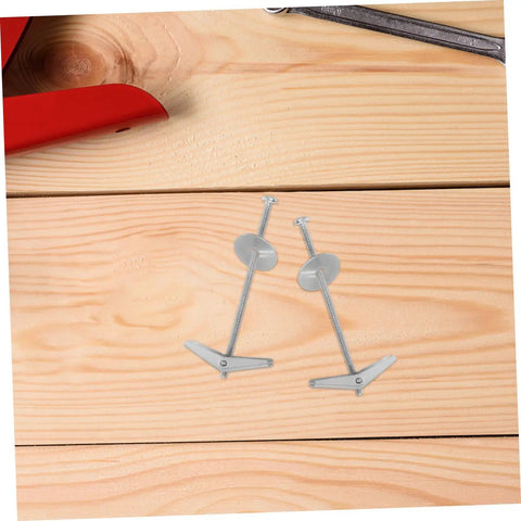 Two metal toggle bolts from 15-Piece Toggle Bolt Kit With Wing Nuts For Drywall Anchors Heavy Duty Butterfly Screws on wooden surface